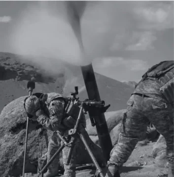 Soldiers using a mortar