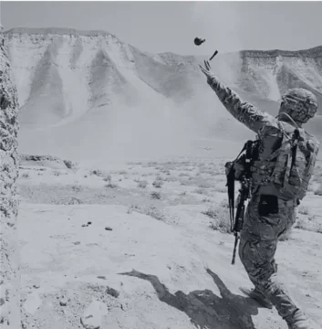 Soldier throwing a grenade